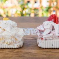 Strawberry or Mango with Cream  · Your choice of delicious strawberries or Mango  with sweet cream sauce and topped with whipp...