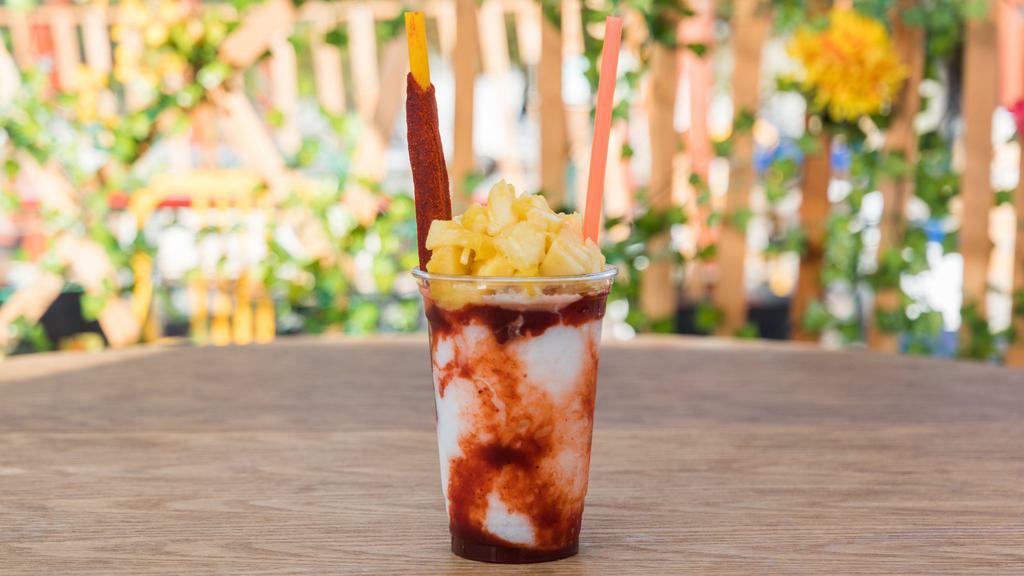 Monkilada 20 Oz · Shaved ice, piña colada concentrate, chamoy and topped with fresh pineapple.