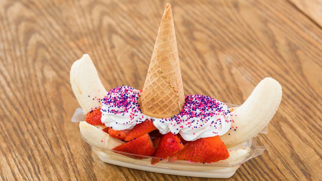Banana Unicorn · Banana with a delicious three milk cream, topped with whipped cream, strawberries, Hershey's and rainbow sprinkles.