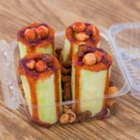 Pepino Loco · Cucumber filled with chamoy, tamarind candy and Japanese peanuts.