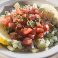 Shepherd's Salad · Chopped tomatoes, cucumber, red onion, parsley, olive oil.