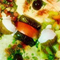 Mediterranean Platter · 2 falafel balls, 2 dolmas, 4 sides: hummus, baba gannouj, tabbouleh & green salad, served wi...