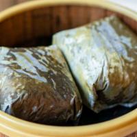 A9. Sticky Rice in Lotus Leaf 荷香干貝糯米雞 · Sticky rice with shrimp, cha siu, mushroom, and egg yolk steamed in fragrant lotus leaf.