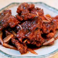 E17. Peking Spare Ribs 京都排骨 · With sweet and sour sauce.