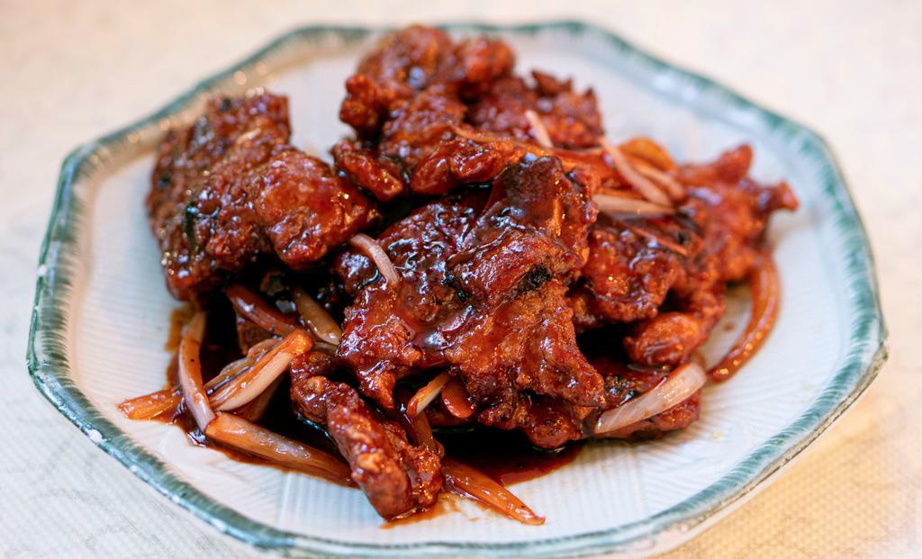 E17. Peking Spare Ribs 京都排骨 · With sweet and sour sauce.