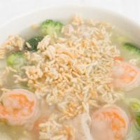 Sizzling Rice Soup · Crispy rice soup vegetarian style or chicken, shrimp & veggies.