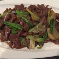 Green Onion Lamb · Wok tossed with green onions & ginger in a soy glaze.