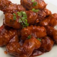 Peking Ribs · Crispy ribs wok tossed in a sweet & sour glaze with a hint of garlic.