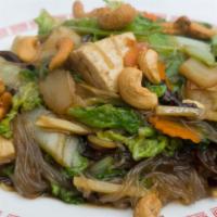 Buddhist Delight · Wok tossed veggies, silk  noodles, tofu & topped with roasted cashews