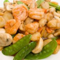 Pea Pod & Water Chestnuts Saute · In a garlic sauce topped with cashews.
