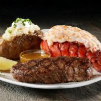 Steak & Lobster · Sizzler favorite - wild-caught cold water lobster tail served with at 6oz tri-tip sirloin an...