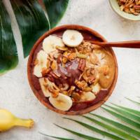Awesome Almond Power Bowl · Acai bowl topped with granola, bananas, almond butter, and honey.