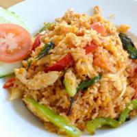 Basil Thai Fried Rice · Fried rice with eggs, chili, onions, bell peppers, tomatoes and basil. Medium spicy.