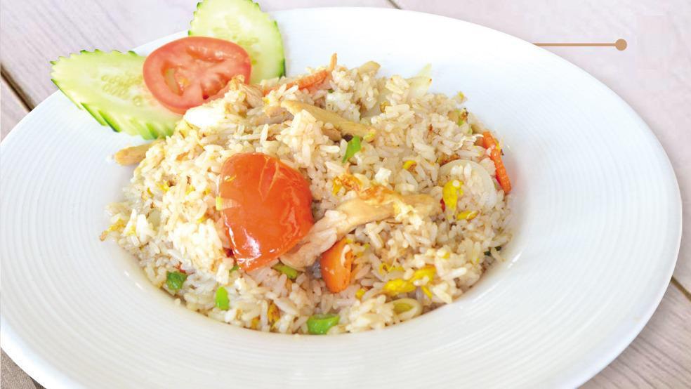 Thai Fried Rice · Jasmine rice is transformed into that Asian favorite, fried rice. This dish is typical fried rice with eggs, green onions and tomatoes.