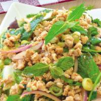 Chicken Salad (Larb) · Minced chicken tossed with spicy lime dressing, red onions, dried chili and a touch of rice ...