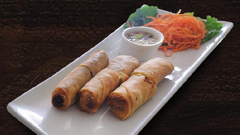 Egg Rolls · Fried rolls stuffed with bean thread noodles, mushrooms, cabbage and carrots.