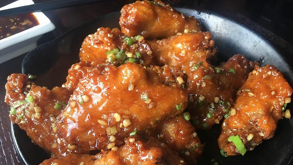 76. Japanese Chicken Wings · (deep fried chicken wings sauteed with  garlic, green onion in our special homemade sweet & spicy sauce, crispy & juicy).