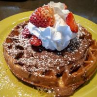 Nutella Waffle · Topped with strawberries, whipped cream and powdered sugar.