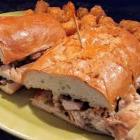 Chicken Philly · Thin sliced grilled chicken with sauteed mushrooms, onions, peppers and cheese on French roll.