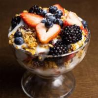 Yogurt Parfait · Low fat yogurt layered with mixed berries and granola.