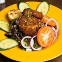 Crab Cake Salad · Homemade crab cakes on a bed of spring mix with cucumber, tomato, red onion, and choice of d...