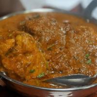 Chicken Tikka Masala · Chicken chunks cooked with spiced tomato creamy sauce.