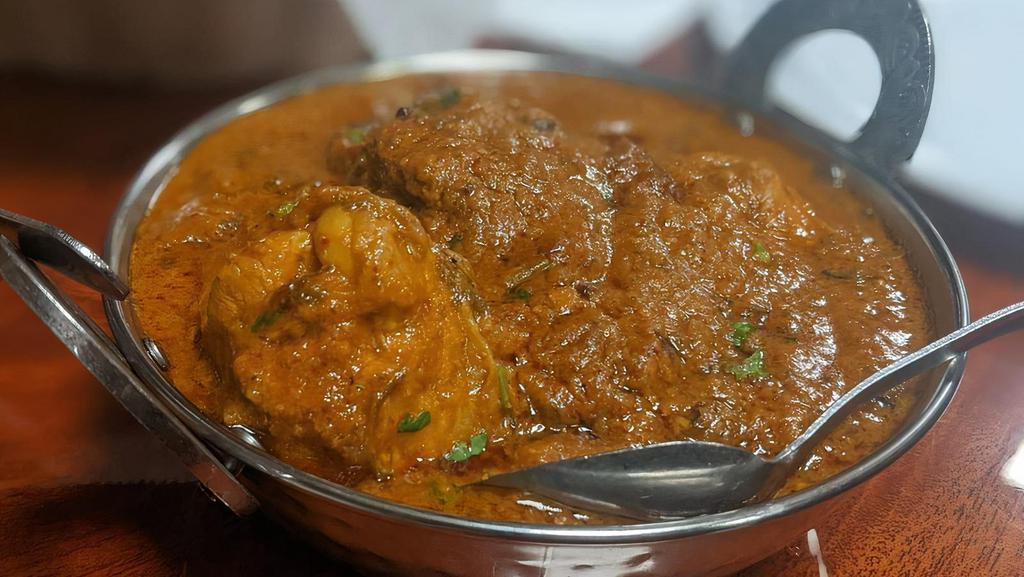 Chicken Tikka Masala · Chicken chunks cooked with spiced tomato creamy sauce.