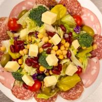 Large Antipasto Salad · Romaine and iceberg lettuce topped with dry salami, mortadella, capicola, red cabbage, tomat...