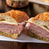 Muffaletta Sandwich · Ham, genoa salame, mortadella, provolone, oil and vinegar, muffalata spread