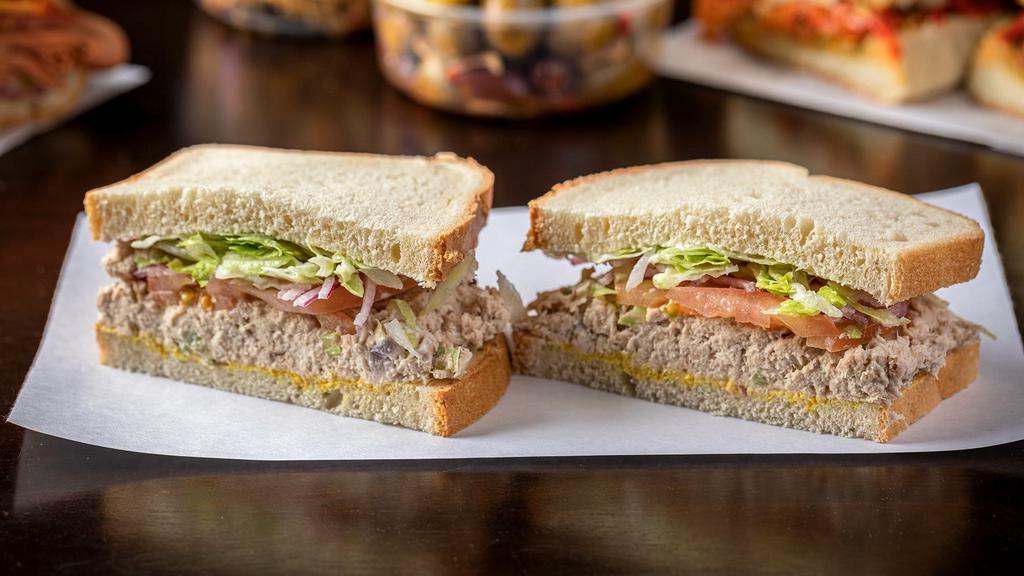 Tuna Sandwich · Albacore tuna,Lettuce, onions, pickles,mayo,mustard