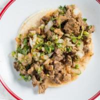 Taco · W/meat, onions, cilantro, hot salsa.