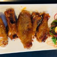 Fried Chicken Wings (6 pieces) · Fried chicken wings tossed in your choice of sauce: BBQ sauce, Mango habanero sauce or Terri...
