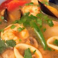 Tom Yum Sea Food · Hot and sour soup with white fish, shrimp, squid, scallops, mussels, mushrooms, tomato, lemo...