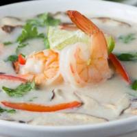 Tom Kha Kung · Coconut soup with shrimp, mushrooms, lemon grass, galanga, and lime juice.