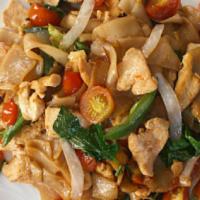 Pad Kee Mow Noodle · Spicy Pan-fried flat noodle with cabbage, bell pepper, carrots, bean sprouts chili and basil.