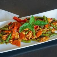 Pad Prig Khing · Stir-fried with curry paste, string beans, bell peppers, chili, carrots, and kaffir leaves.