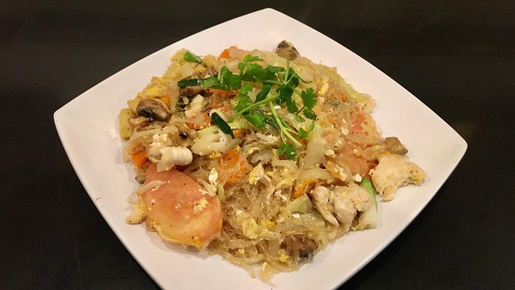 Pad Woonsen · Stir-fried silver noodle, corn, cabbage, onion, tomato, carrots, mushrooms.