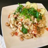 Pineapple Fried Rice · With eggs, carrots, onions, tomatoes, pineapples, and CASHEW NUTS.