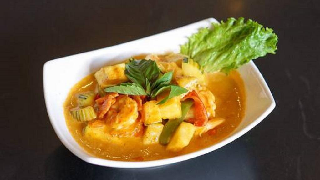 Panang Curry · With bell pepper, zucchini, carrots, basil and PEANUT sauce in panang curry.