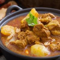 Massaman Curry · With potatoes, onions, PEANUTS and massaman curry.