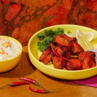 Chicken Tikka · Spicy chicken in a buttery tomato sauce. Includes side of Rice.
