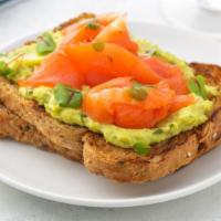 Avocado Toast with Salmon · Our thick-cut sourdough toast topped with fresh smashed avocado, salmon, arugula, and cherry...