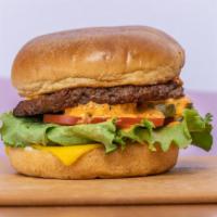 Indigo Burger · 1/4 lb. Impossible 2.0 patty, cheddar cheese, house spread, tomato, green lettuce, house pic...
