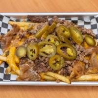 Loaded Fries · Impossible meat crumbles, grilled onions, jalapeños, and original house nacho cheese sauce. ...