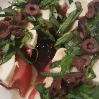 Caprese Salad · Fresh tomato fresh sliced mozzarella cheese shredded basil kalamata olives then topped with ...