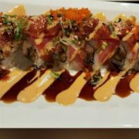 #20. Magoro Fever Roll · Real crab meat & deep fried eel top with seared tuna, spicy tuna, avocado & creamy sauce.