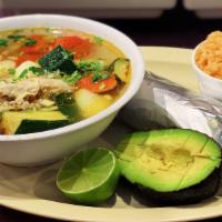 Caldo de pollo/Chicken soup · Served with rice, lime, avocado and tortillas