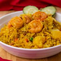 33. Pineapple Fried Rice · Fried rice with prawn, chicken,  egg, pineapple, raisin, cashew nut, onion, pea and carrot.