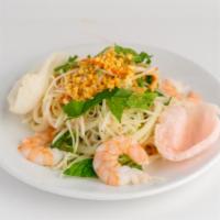 Green Papaya Shrimp Salad · Steamed shrimp mixed with shredded green papaya, tofu, carrot red onion, mint leaves an grou...