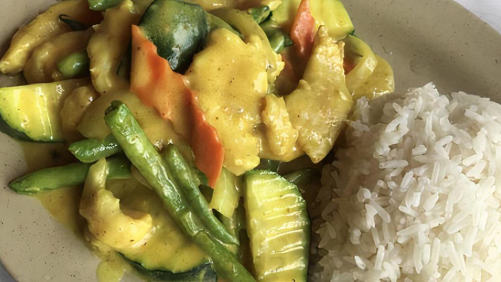 Curry Chicken · Sauteed tender chicken breast with carrots and string beans with coconut milk curry. Served with white rice.